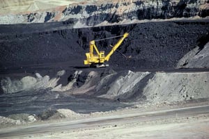 Yellow mining machine drilling in a US coal Site