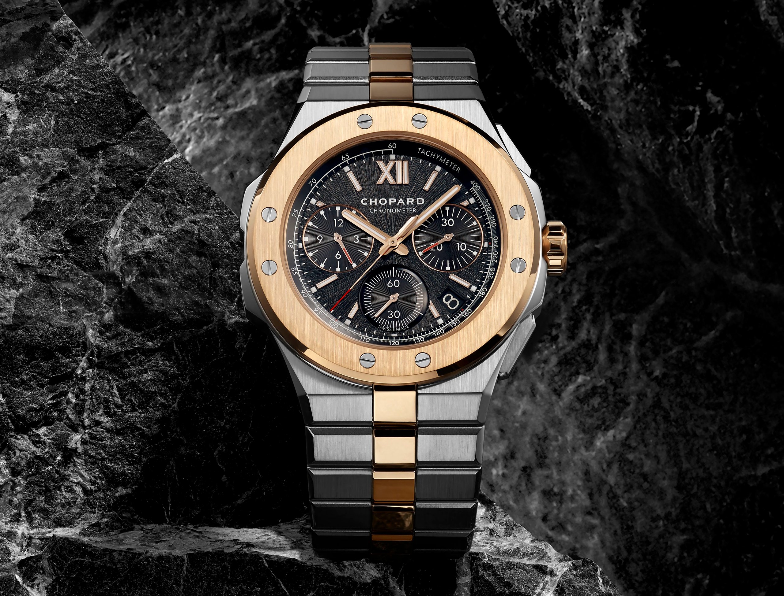 Chopard Chronometer watch on dark rocks.