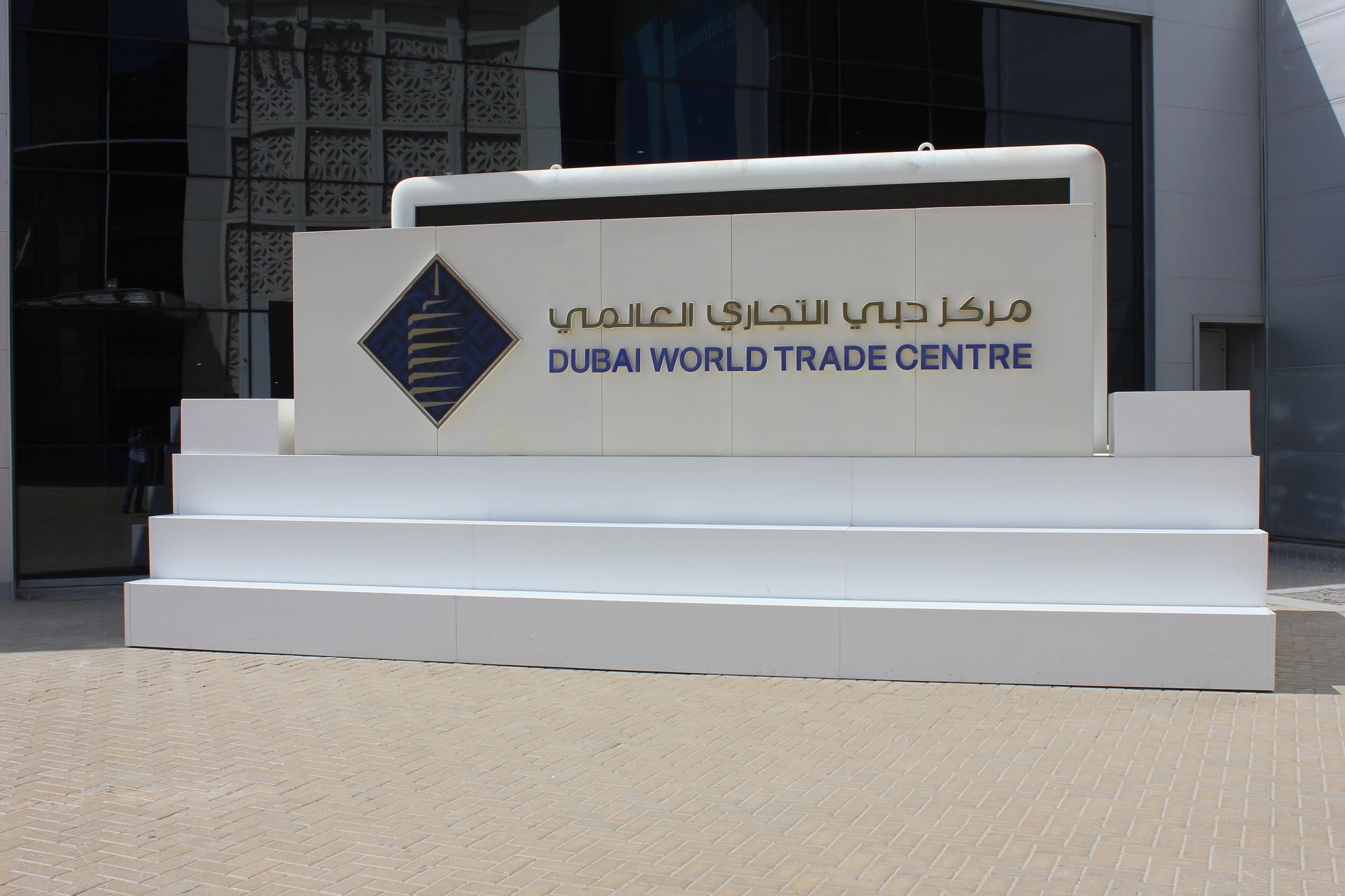 Dubai World Trade Centre sign outside building.