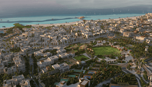 Coastal town with beach and turquoise ocean.