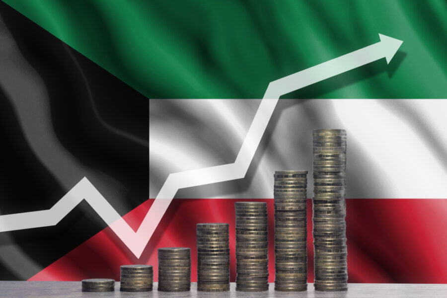 Stacks of coins increasing in height with an upward arrow on a Kuwaiti flag.