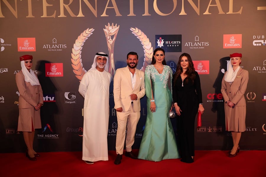 Red carpet photo with flight attendants, sponsors.