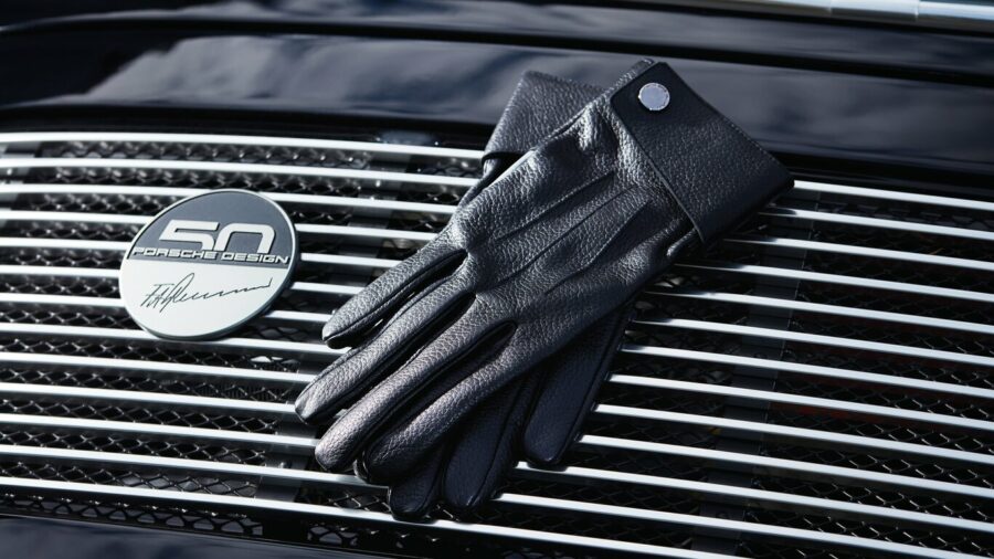 Leather gloves on a car grill with 