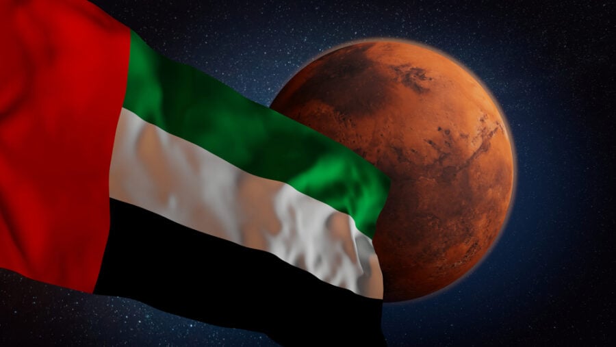 UAE flag near Mars in space.