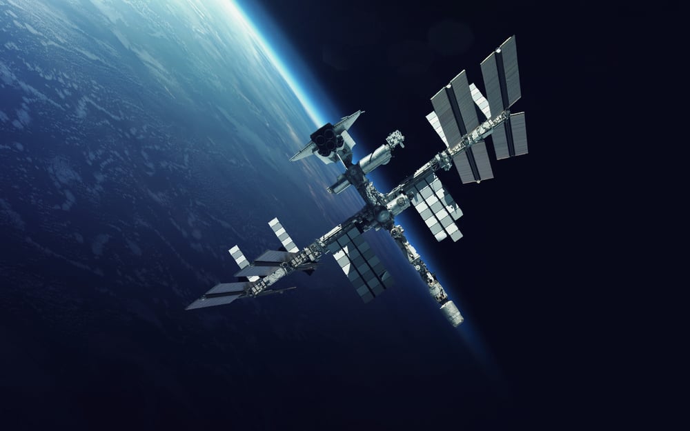 Space station orbiting above Earth in space.
