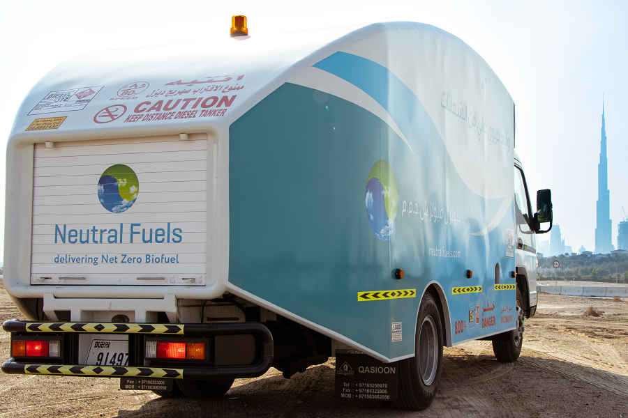 Diesel tanker delivering Net Zero Biofuel with cityscape in the background.