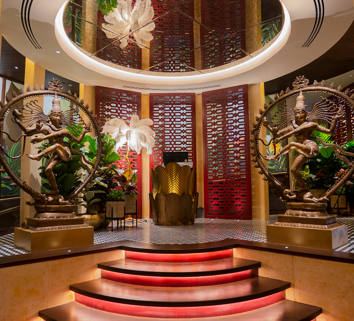 Bronze Nataraja statues in a decorated interior.