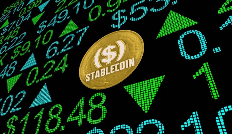 Gold stablecoin on a black display with currency values.