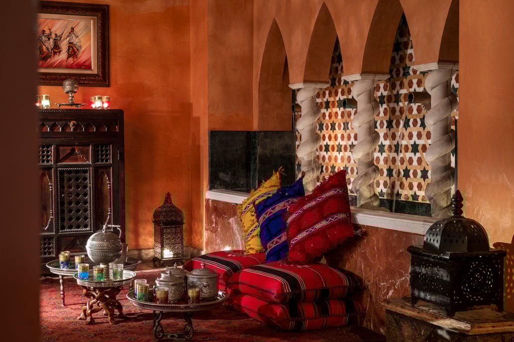 Moroccan-style room with tea sets.