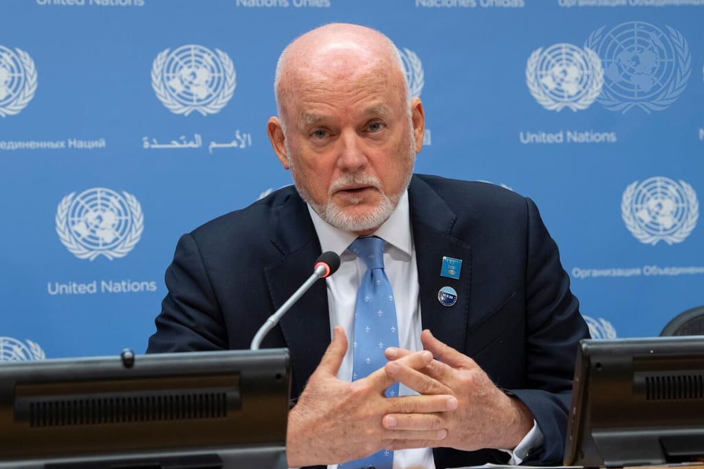 Bald man at UN press conference.