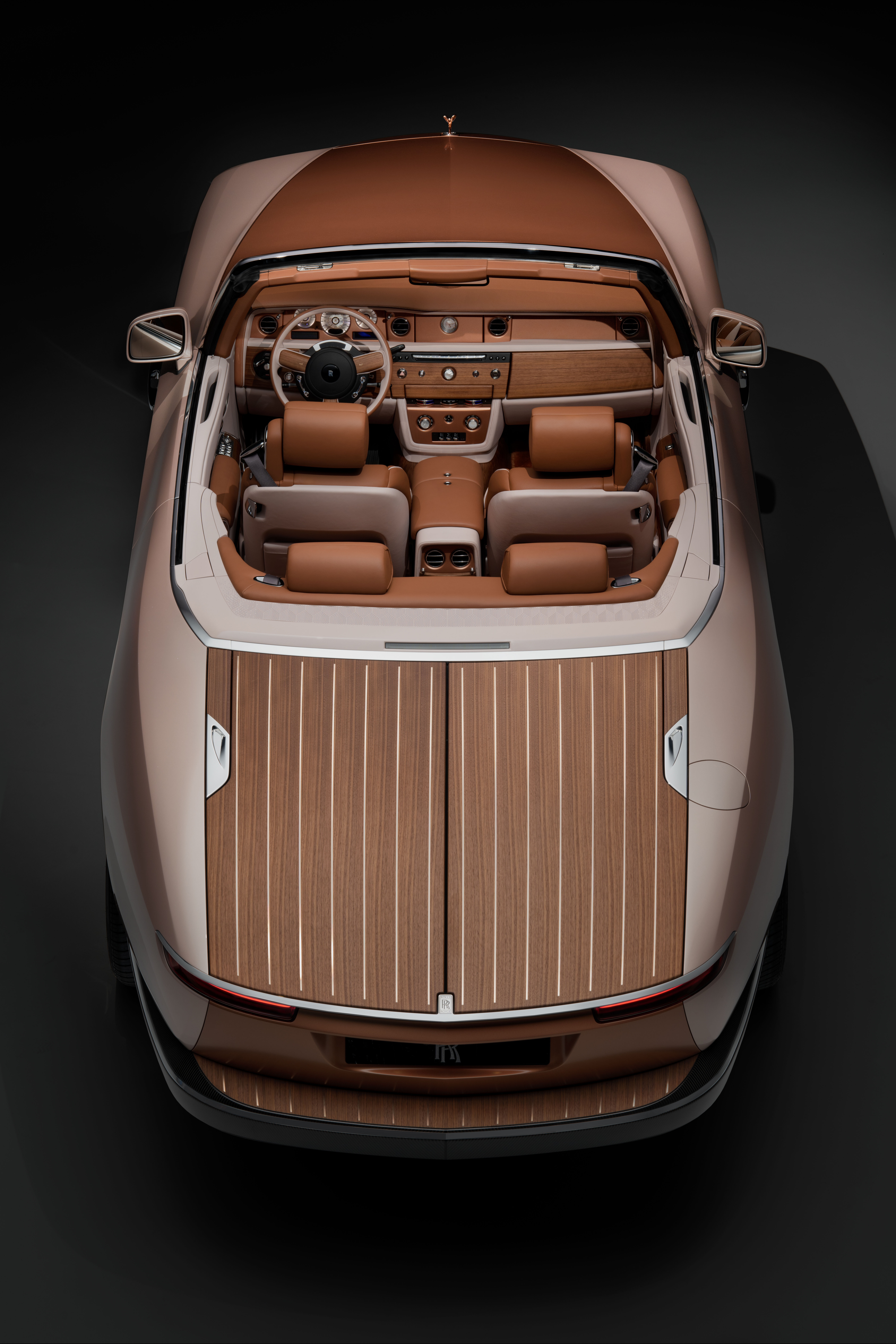 Rolls-Royce Dawn convertible with top down, viewed from above.