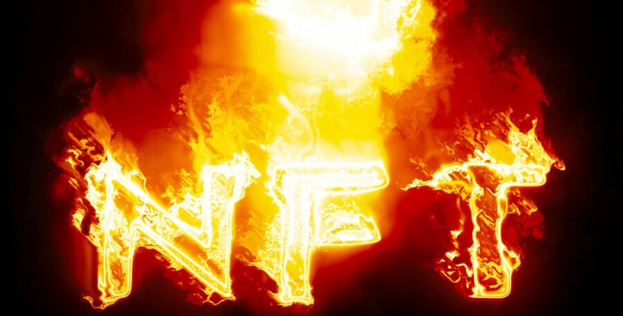 Burning "NFT" letters in fiery orange flames.