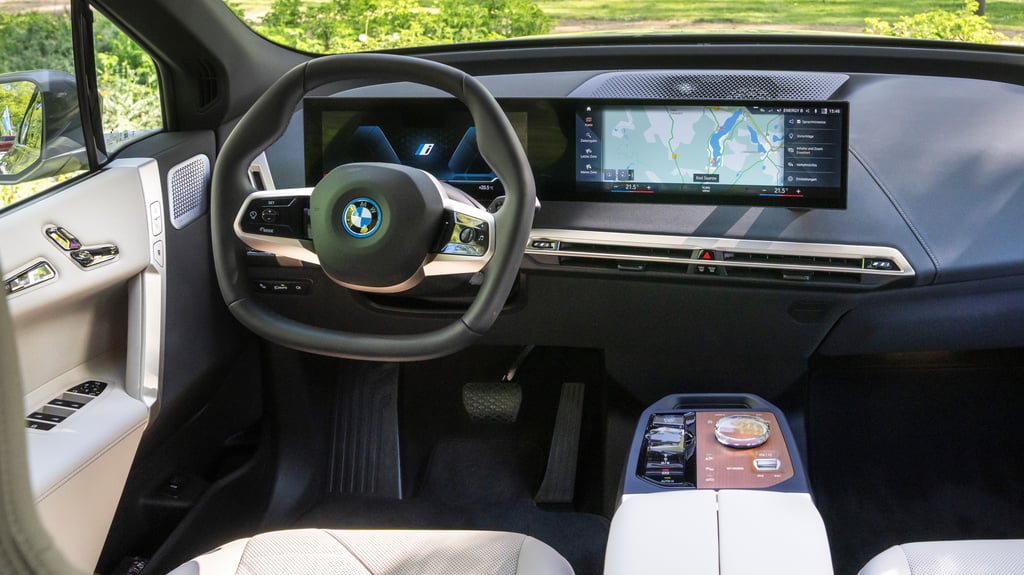 BMW iX interior showing a map on the central infotainment screen.