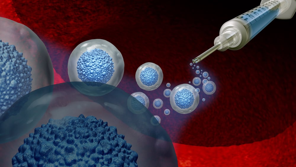Syringe injecting blue cells into larger translucent cells.