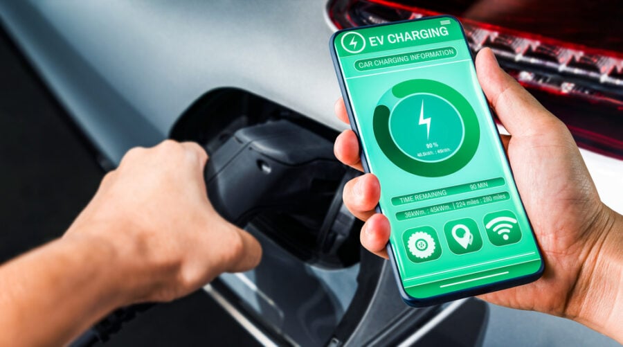 EV charging station with smartphone display.