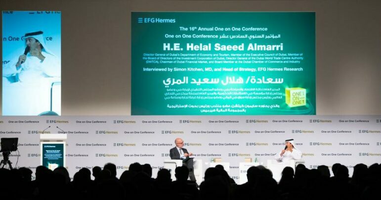 Panel discussion with two individuals being interviewed.