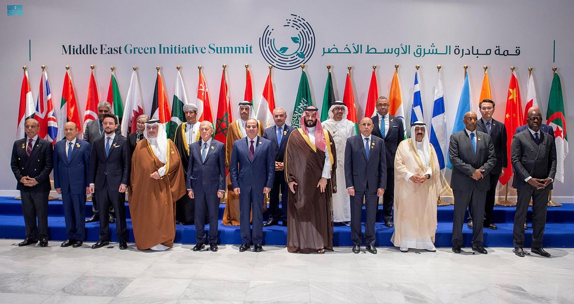 Group photo of men in suits and traditional attire at the Middle East Green Initiative Summit.