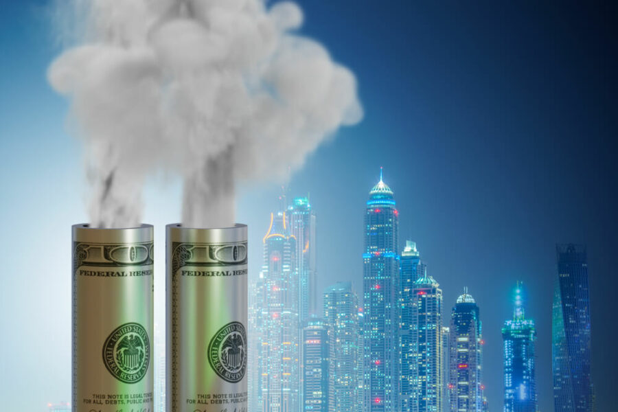 Hundred-dollar bills emitting smoke against a city skyline at night.