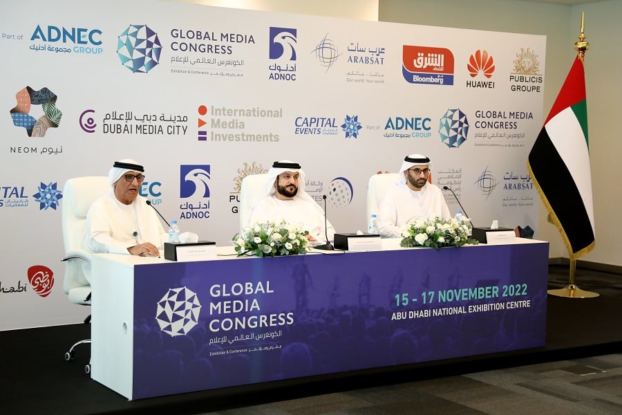 Men in Arab attire at a Global Media Congress press conference.