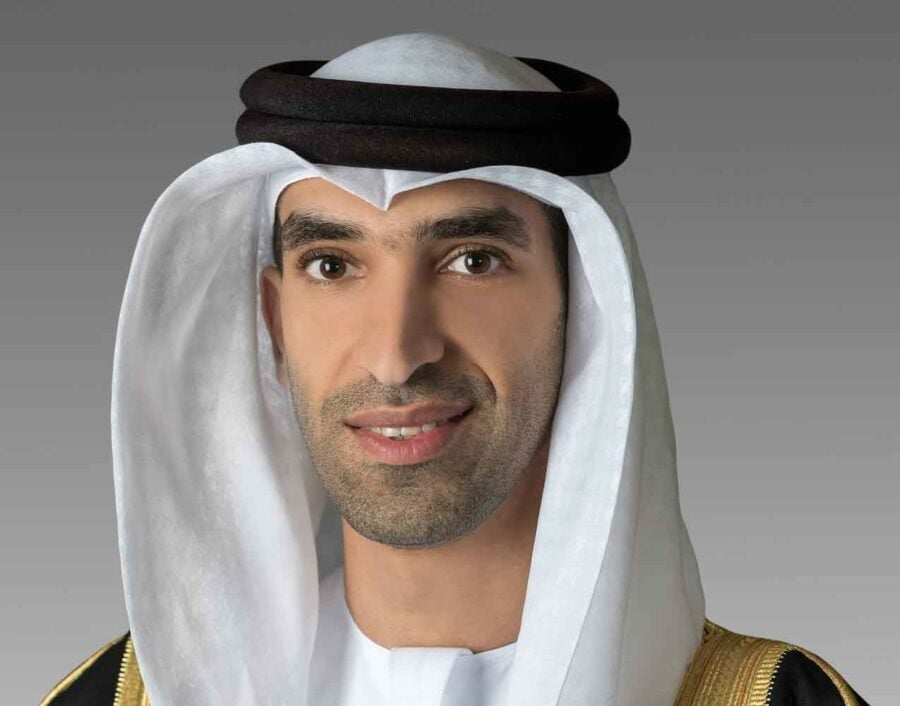 Man in traditional Middle Eastern attire smiling.