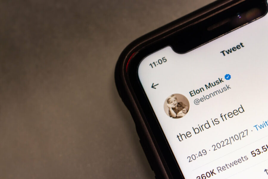 Smartphone showing Elon Musk's "bird is freed" tweet.