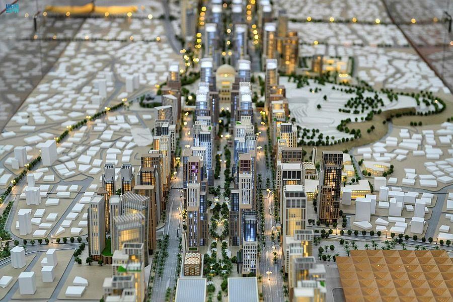 Illuminated city model viewed from above.