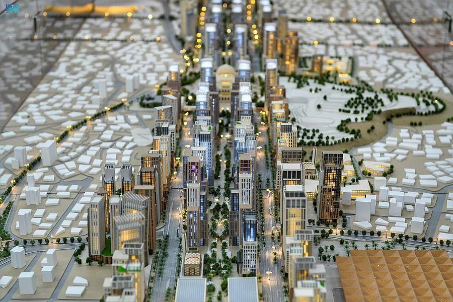 Illuminated city model viewed from above.