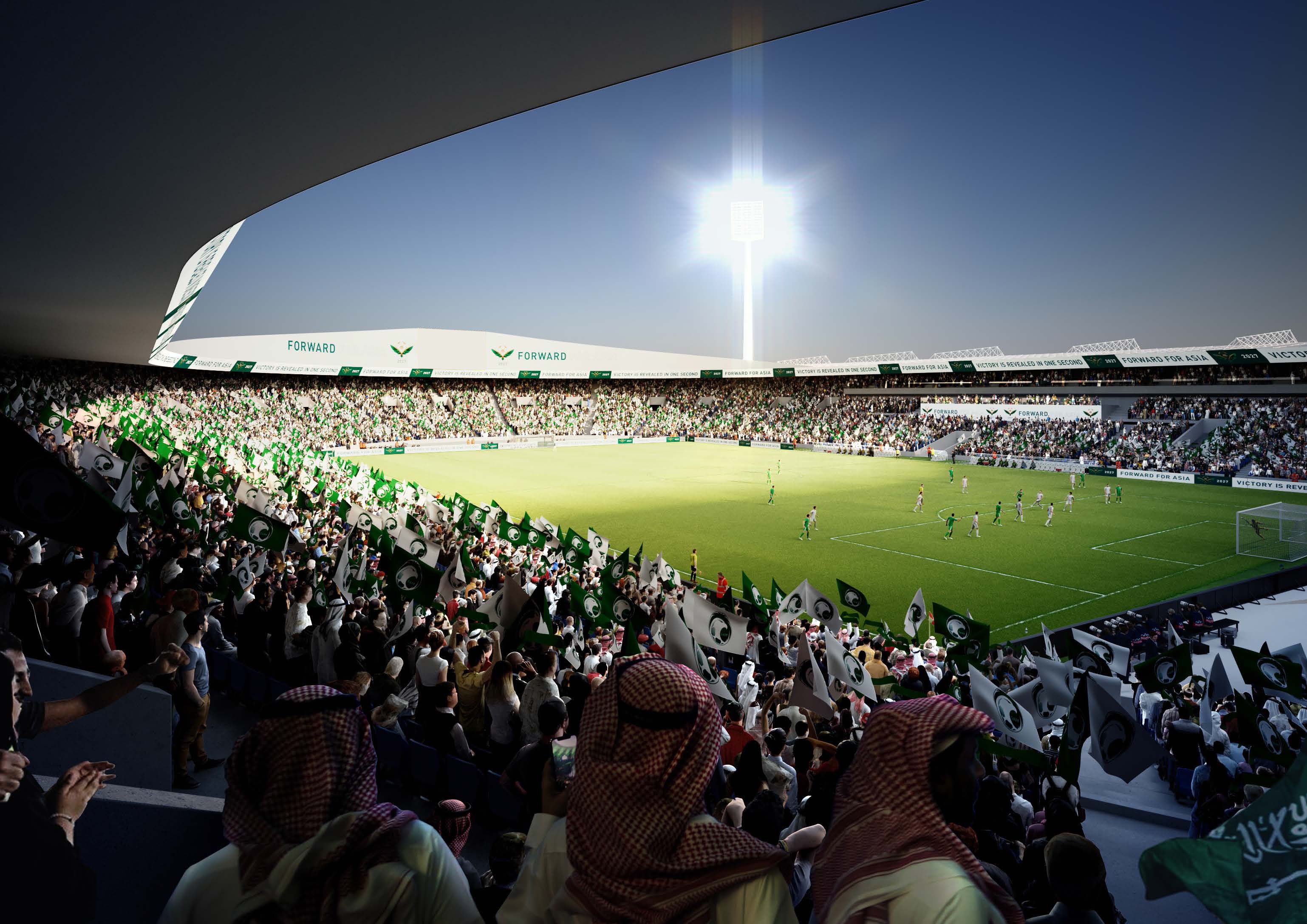 Crowd in traditional attire watches a soccer game at night.