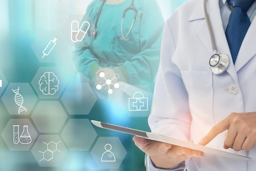 Doctor using a tablet displaying medical icons in a healthcare setting.