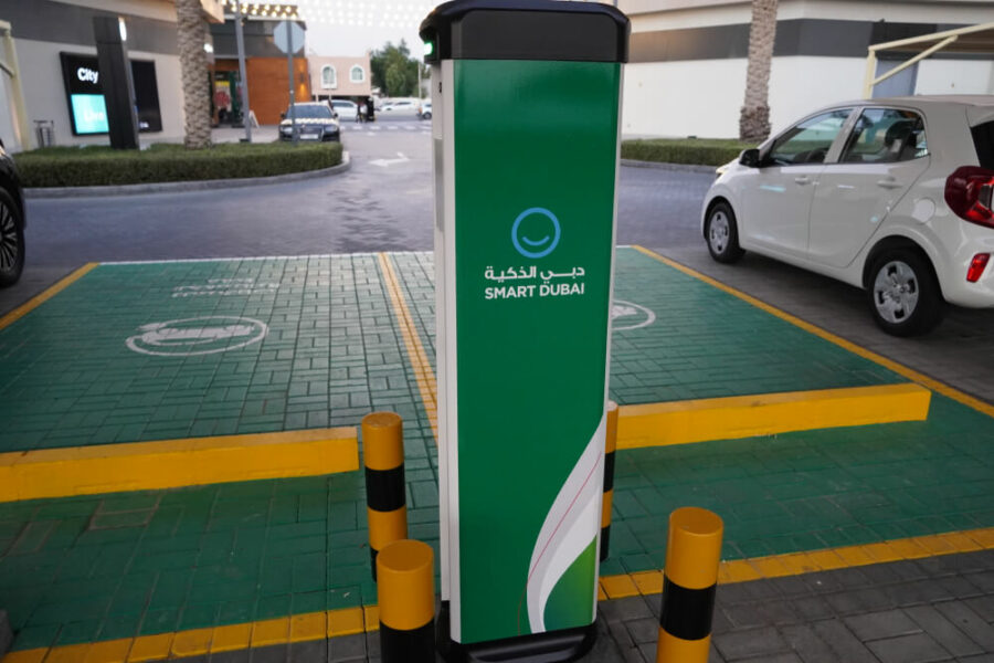 Smart Dubai EV charging station in a parking lot.