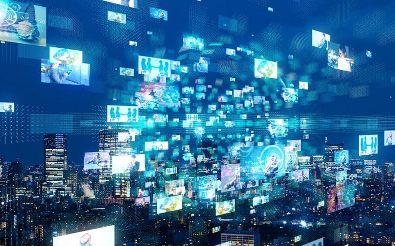 Digital images floating above a nighttime city, connecting information.