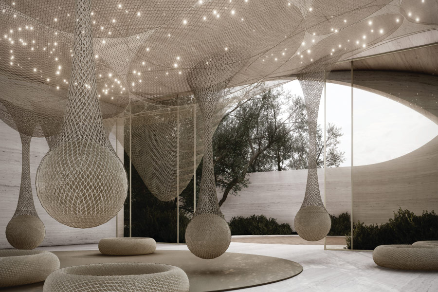 Illuminated teardrop-shaped structures in a building.