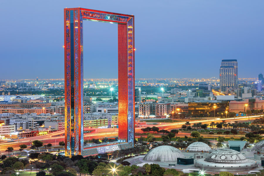 Red frame near park and highway at dusk.