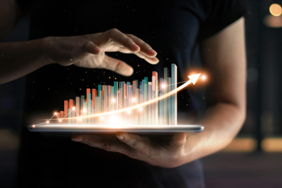 Tablet showing upward-trending 3D bar graph.