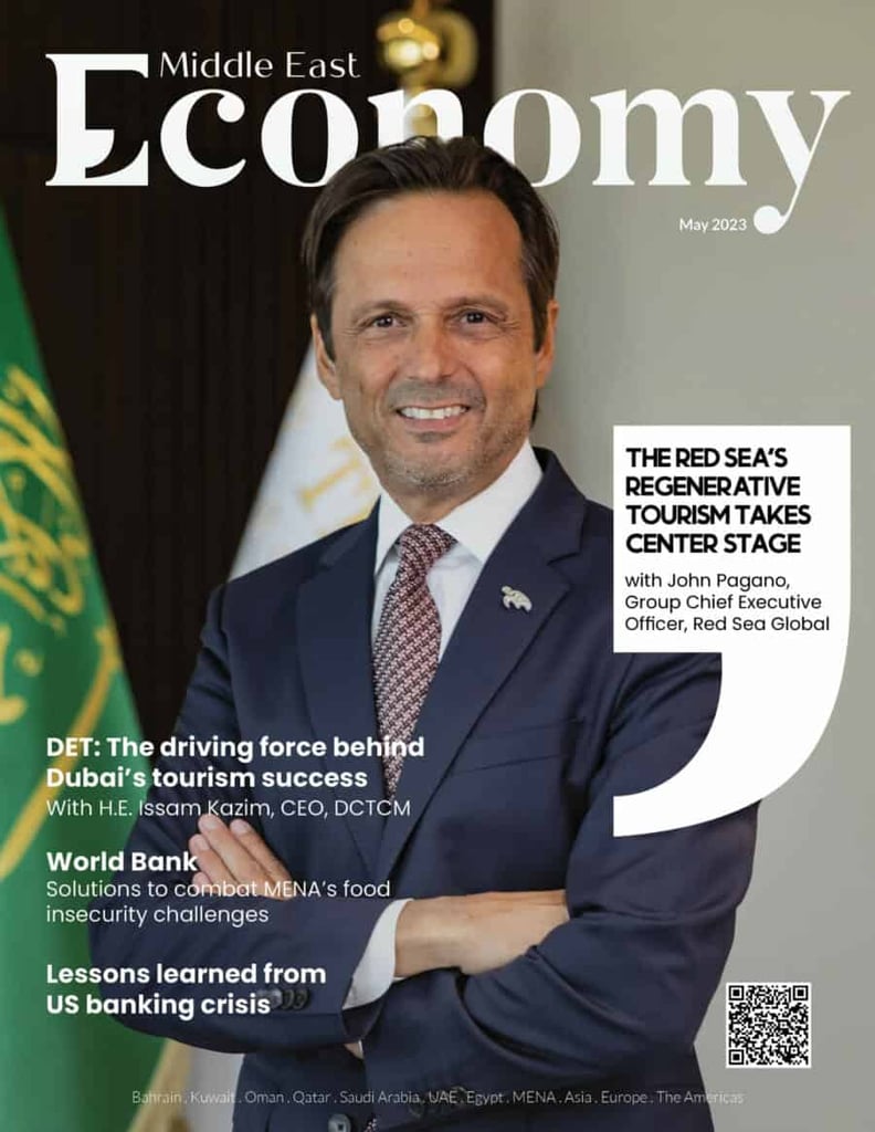 Man on a "Middle East Economy" magazine cover with May 2023 topics.