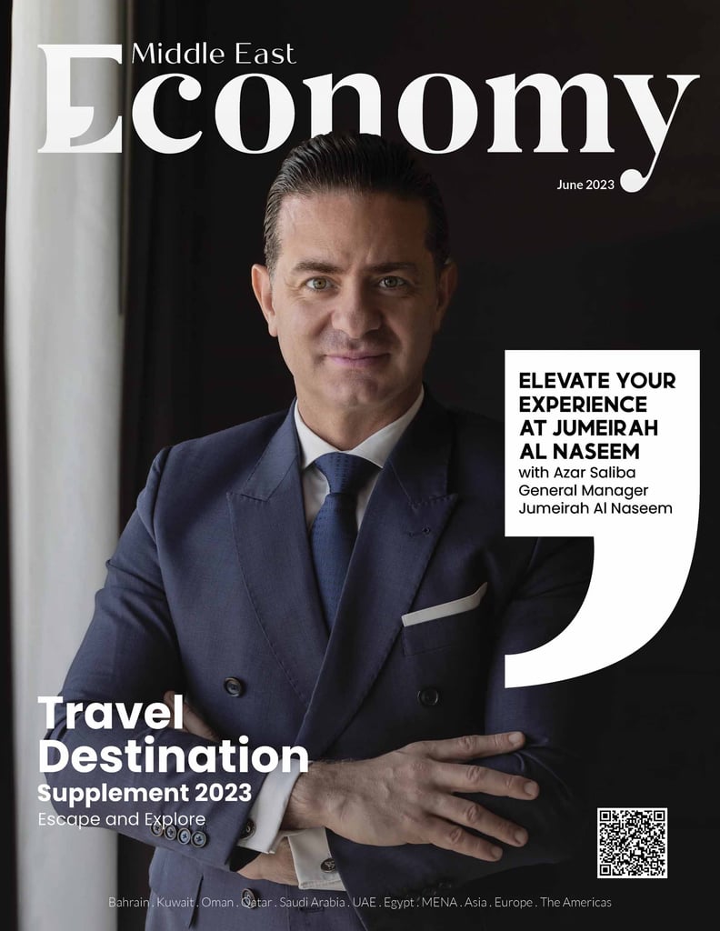 Man in a suit on a magazine cover, advertising a travel destination.