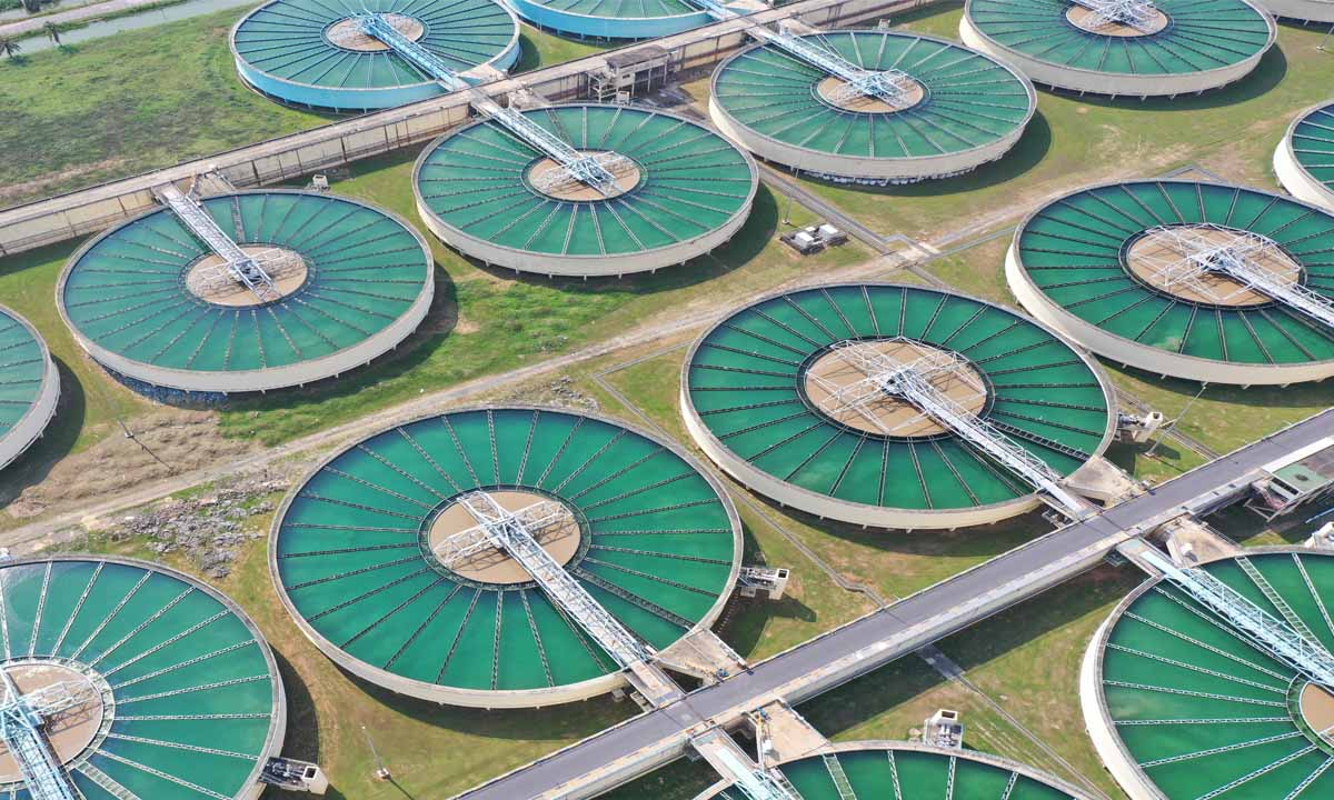 Circular water treatment basins at processing facility.