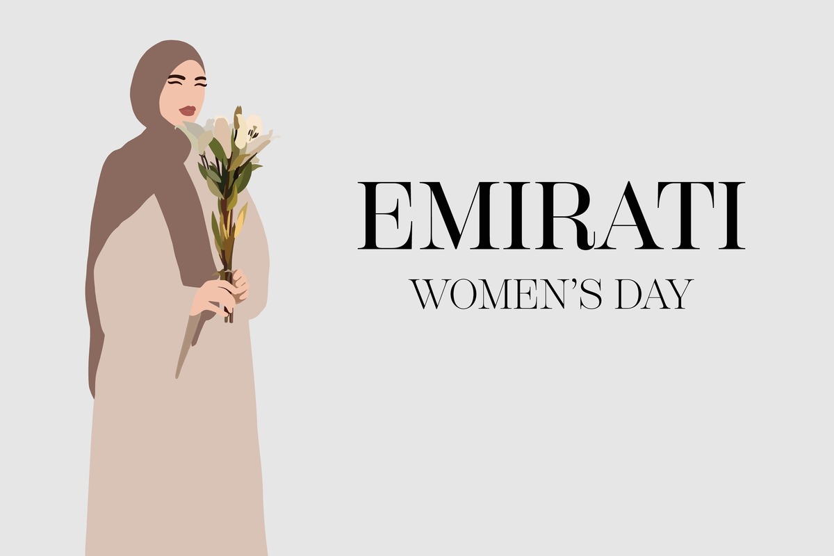 Woman holding flowers for Emirati Women’s Day.