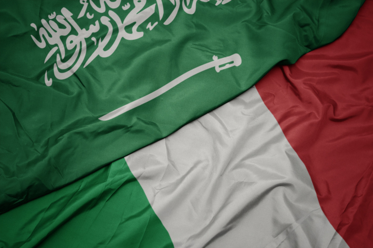 Saudi and Italian flags draped together.