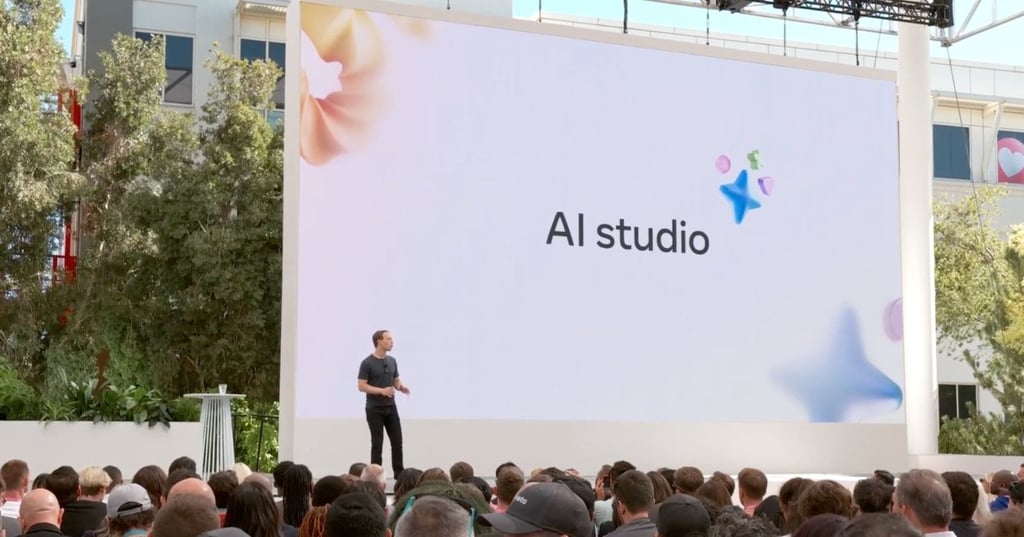 Man presenting at an outdoor event with AI Studio displayed.