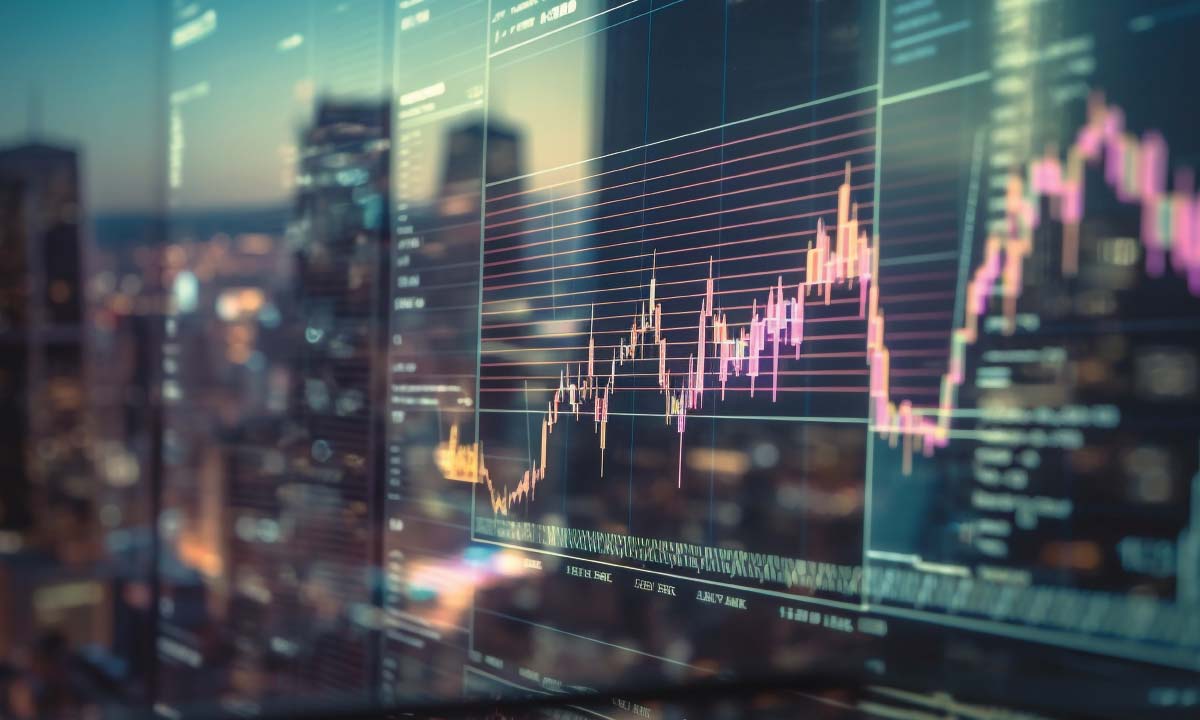 A large screen displays a fluctuating stock market graph with a city skyline.