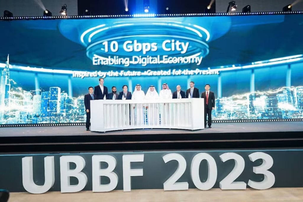 Group on stage at "UBBF 2023" event.