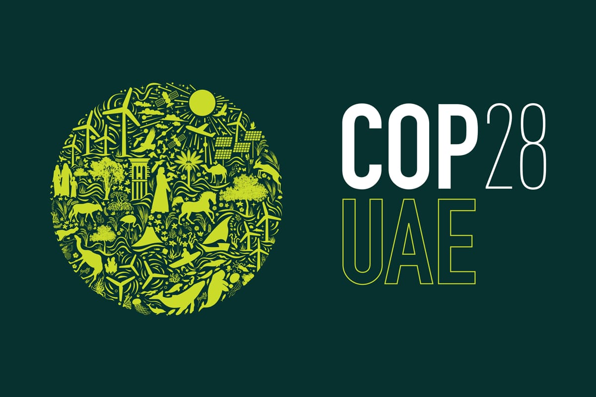Green circle with environmental icons beside "COP28 UAE".
