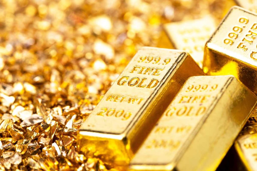 Gold prices dip with stronger dollar, cautious rate cut approach