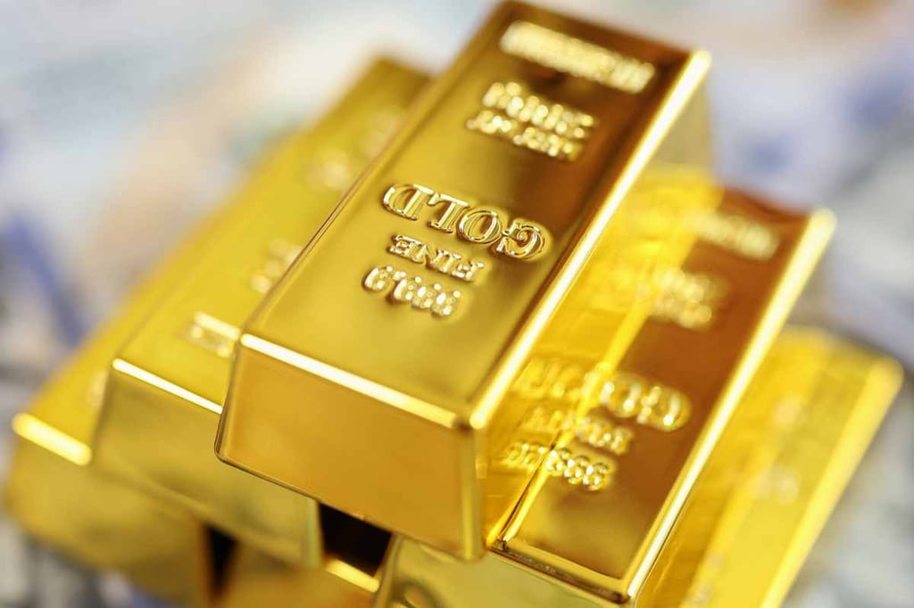 Gold prices post modest gains as U.S. dollar weakens