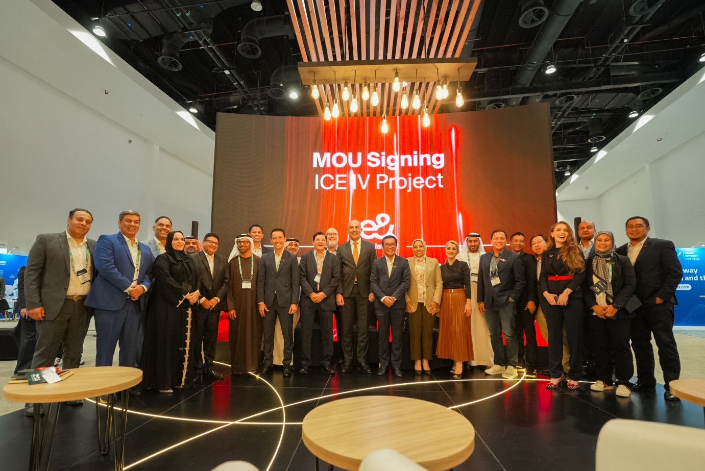 A group poses after signing the MOU for the ICE IV Project at a convention center.