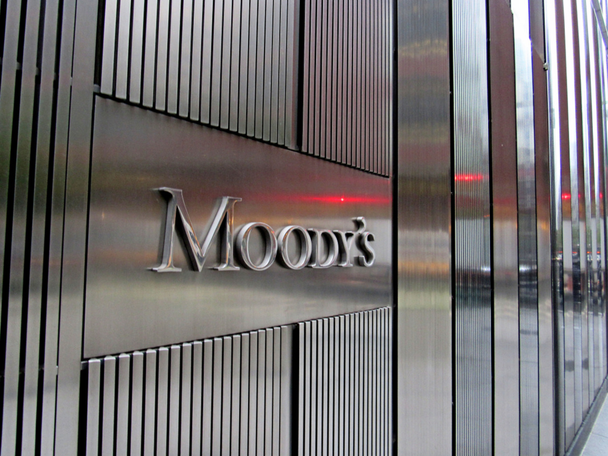 Moody's logo on a metallic building with grooved panels.