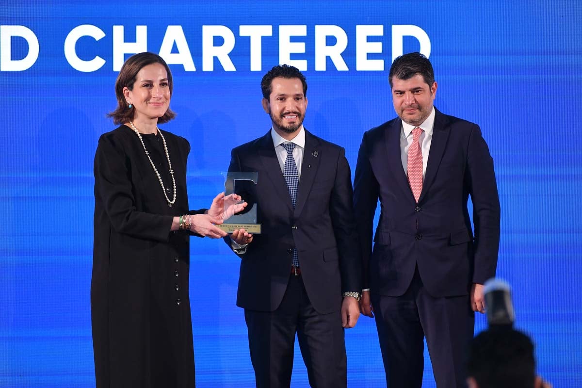 Senior officials from Standard Chartered Bank receive the recognition for a bank that has been unlocking growth opportunities
