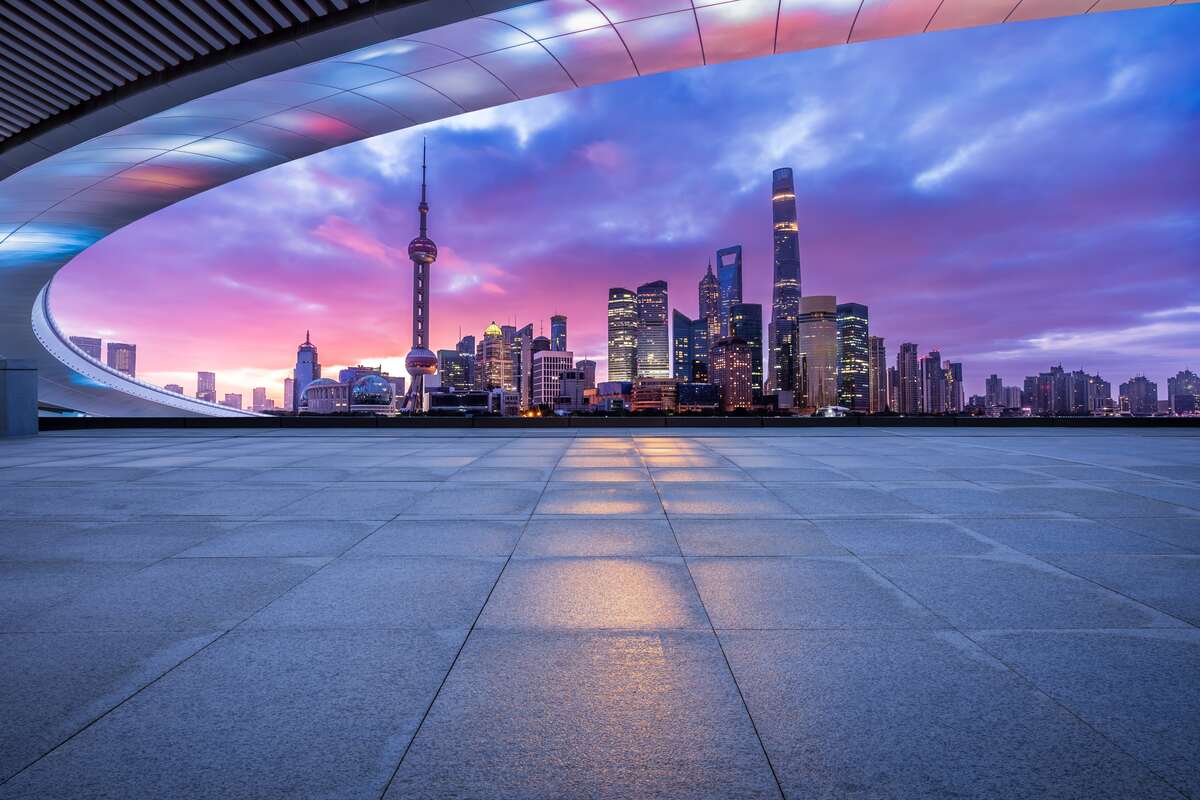 Plaza overlooking a cityscape at dawn.