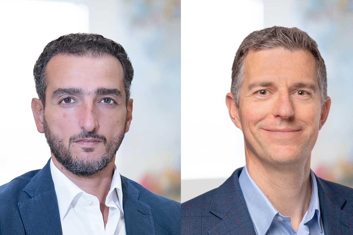 Two men in business attire pose for headshots.